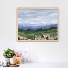 Framed landscape painting depicting rolling green hills and distant mountains under a cloudy sky. Colorful Scenery, Ski Town, Acrylic Landscape, Landscape Paintings Acrylic, Mountain Wall, Botanical Collection, Mountain Wall Art, Blue Ridge Mountains, Mountain Range