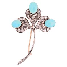 Introducing a stunning Art Deco brooch that exudes timeless elegance and charm. This exquisite piece features a clover-shaped design adorned with three captivating turquoise cabochons and dazzling rose-cut diamonds, all set in 14K yellow gold. The brooch showcases a meticulously crafted clover shape, symbolizing luck and prosperity. The smooth and vibrant turquoise cabochons, known for their striking blue-green hues, add a pop of color and a touch of serenity to the design. Each cabochon is care Brooch Art, Art Deco Brooch, Antique Brooches, Diamond Brooch, North Coast, Art Deco Jewelry, Rose Cut Diamond, Belleza Natural, Ruby Lane