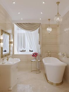 a bathroom with a tub, sink and chandelier