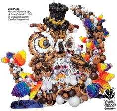 an owl statue made out of balloons and other items is featured in the cover of this magazine