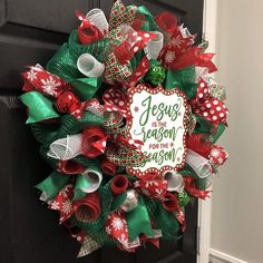 a christmas wreath on the front door with jesus is coming for me written on it