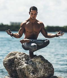 a man doing yoga on top of a rock near the ocean with text that reads 5 reasons why dudes should practice yoga