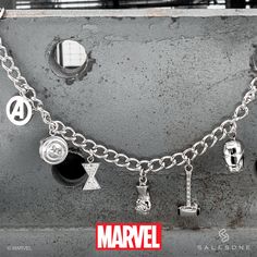 a close up of a metal object with various charms on it's chain and magnets attached to it