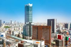 an aerial view of a city with tall buildings and lots of other high rise buildings