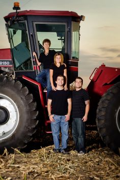 a family standing in front of a tractor