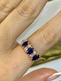 Metal: 14kt Rose Gold Stones: Sapphire And Diamond  Stone Shapes: Oval And Round  Sapphire Weight: 1.78 Carats  Diamond Weight: 0.37 Carats  Weight: 5.28Grams  Width Of Top Part Of Band: 7.00mm Size: 7 Sizing: Please state in personalization box. Luxury Multi-stone Rose Gold Sapphire Ring, Luxury 14k Rose Gold Oval Jewelry, Luxury Multi-stone Sapphire Ring In Rose Gold, Luxury Rose Gold Multi-stone Sapphire Ring, Luxury Sapphire Rose Gold Ring, Formal Rose Gold Sapphire Jewelry, Rose Gold Sapphire Jewelry With Brilliant Cut, Formal Multi-stone Rose Gold Jewelry, Formal Rose Gold Multi-stone Jewelry