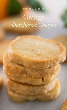 orange shortbread cookies stacked on top of each other