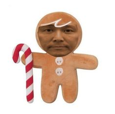 a gingerbread man with a candy cane in front of him and the image is made out of cardboard