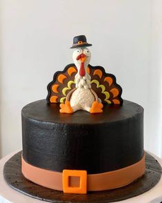 a black cake with a turkey on top