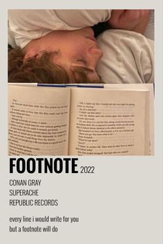 a man laying in bed reading a book with his head on top of an open book