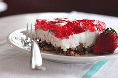 a piece of cheesecake with strawberries on top