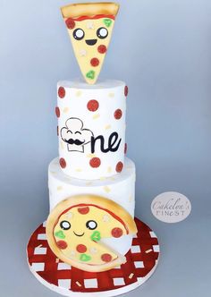 a three tiered cake with two slices of pizza sitting on top of each other