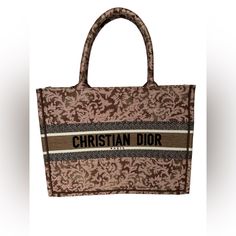 These Are Professional Pictures Of The Actual Item Offered By Mr. Goods. Brand New Never Been Used No Box No Dustbag No Major Flaws No Signs Of Use Size Length: 14.00 In Height: 10.75 In Width: 6.25 In Drop: 6.00 In This Is An Authentic Christian Dior Canvas Embroidered Medium Brocart Book Tote In Metallic Pink. His Colorful Tote Is Finely Crafted Of Embroidered Canvas In Pink. The Bag Features Matching Canvas Rolled Handles, With The Christian Dior Logo Embroidered Across The Front. The Bag Ope Brown Rectangular Bag With Embroidered Logo, Designer Brown Bags With Embroidered Logo, Designer Embroidered Shopping Bag, Designer Embroidered Bags For Shopping, Brown Bags With Embroidered Logo For Shopping, Luxury Bags With Embroidered Logo For Shopping, Designer Bags With Embroidered Logo For Shopping, Designer Shopping Bag With Embroidered Logo, Elegant Shopping Bag With Embroidered Logo