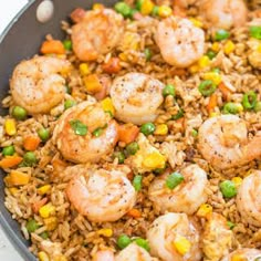 shrimp and rice with peas in a skillet