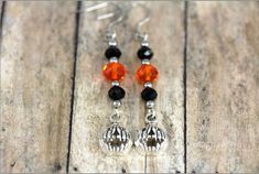 "These festive pumpkin earrings are adorned with beautiful orange and green swarovski crystal beads. A wonderful addition to your holiday accessories. ♥ earrings measures 1-7/8\" (5 cm) long on french hooks ♥ pumpkin measures approx. 1/2\" x 1/2\" (12 mm x 12 mm) ♥ surgical steel french hook earrings ♥ a pair of soft plastic earring stoppers are included ------------------------------------------- ♥ STERLING SILVER FRENCH HOOK EAR WIRES UPGRADE Please purchase the following listing to upgrade: h Lantern Earrings, Pumpkin Jewelry, Holiday Accessories, Jewelry Halloween, French Hook Earrings, Earrings Halloween, Plastic Earrings, Pumpkin Earrings, Swarovski Crystal Beads