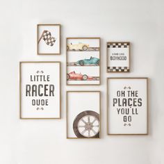 four framed pictures hang on the wall above a shelf with cars and checkered rugs