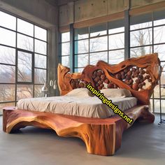 a bed made out of wood sitting on top of a floor next to large windows