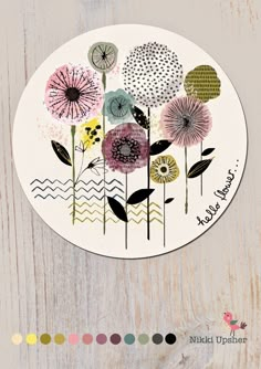 a paper plate with flowers on it and the words, make your own art work