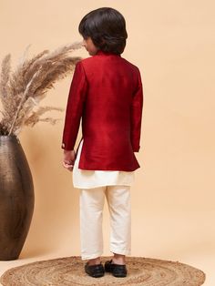 VASTRAMAY Boy's Maroon Indo Western Jacket With Cream Kurta And Pyjama Set Discover the perfect blend of tradition and style with the VASTRAMAY Boy's Maroon Indo Western Jacket With Cream Kurta And Pyjama Set. Crafted to impress, this outfit is ideal for special occasions, offering comfort and sophistication. Features Traditional Indo Western design Includes maroon jacket, cream kurta, and pyjama Perfect for festive and celebratory occasions Specifications Color: Maroon and Cream Material: High- Traditional Sets With Stand Collar For Fall, Traditional Fall Sets With Stand Collar, Traditional Stand Collar Kurta For Fall, Festive Kurta With Stand Collar For Fall, Festive Fall Kurta With Stand Collar, Fall Season Fitted Long Sleeve Sherwani, Traditional Long Sleeve Sets For Fall, Traditional Wedding Sets For Fall, Traditional Fall Wedding Sets