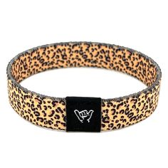 "Accessorize with our popular Leopard print band. Available sizes:  Extra Small 5.5\" (petites + kids) Small 6.5\" (most common fitting size) Medium 7.5\" (large wrists) Large or Anklet 8.5\" (very large wrists or anklet) 1/2\" Width Reversible surf and beachy prints. Elastic blend material, can stretch to desired fit. Packaged in natural drawstring gift pouches. Machine washable. Chlorine and saltwater safe." Casual Black Wristband For Festival, Casual Black Band Wristband Bracelet, Casual Black Wristband Bracelet, Casual Adjustable Bracelet With Black Band, Adjustable Band Bracelet Casual Style, Adjustable Black Band Bracelet For Festivals, Adjustable Casual Band Bracelet, Casual Adjustable Black Band Bracelet, Casual Black Wristband