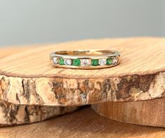 This 9k yellow gold ring has alternate round cut green and white cubic zirconia in a channel setting leading to a plain band.   Stamped 9K and CZ. UK size J   US size 5 Rings can be resized at most high street Jewellers at a minimal cost.  Or if you prefer I can have my goldsmith resize it for you (within reason) at an additional cost from £20 ($30).  All you have to do is add the listing 'Please resize my ring' to your cart. Green Diamond Half Eternity Ring, Green Half Eternity Ring For Anniversary, Green Half-eternity Ring For Anniversary, Green Diamond Ring For Anniversary With Half Eternity Band, Green Diamond Half Eternity Ring For Anniversary, Green Diamond Ring With Half Eternity Band, Green Diamond Half Eternity Round Cut Ring, 14k Gold Green Half Eternity Ring, Green Half Eternity Ring In 14k Gold