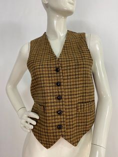 "Pat mcdonagh vest, vintage pat mcdonagh vest, vintage plaid wool vest, women's size small * please see last pictures the back is a little discoloured because of the age of the garment, no rips or tears  Measurements:  Shoulder (outer seam-seam)12\"/bust/chest(armpit-armpit)17\"/waist 16\"/length 18\"-22\"(front)/back length 17\" Mannequin measurements:  5'8\", bust 34\", waist 25\", hip 33\" Please note that vintage clothing sizes can vary greatly.  The Measurements provided  are approximate and are taken lying flat.  I suggest taking a similar garment from your wardrobe and measure it while lying flat.  This way you can compare measurements.  All of our pieces are genuine vintage. Don't forget to enlarge the photos and take a closer look at this genuine vintage item!! I will ship your it