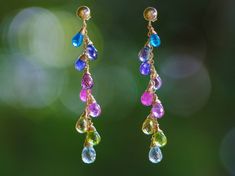 "THE JEWELRY IS SHIPPED via DHL EXPRESS (2-5 days delivery door to door). THE DHL SHIPPING COST IS INCLUDED IN THE PRICE. The Rainbow Lagoon Earrings - Multi Gemstone Colorful Rainbow Earrings Wire Wrapped in Gold Filled ► Measurements / Details: - Length of the earrings including earwires: 2.44\" (~6.2 cm) - Gold: High quality 14K Gold Filled - Silver: High quality Sterling Silver (the posts in silver are round balls) ► Gemstones: The Earrings include excellent AAA quality gemstones, they are n Fine Jewelry Multi-stone Drop Earrings, Multicolor Gemstone-accented Fine Jewelry Earrings, Multicolor Gemstone Accented Fine Jewelry Earrings, Elegant Rainbow Earrings, Multicolor Gemstone Long Drop Earrings, Multicolor Gemstone Accent Fusion Earrings, Multicolor Teardrop Earrings With Gemstone Accents, Multicolor Long Drop Gemstone Earrings, Elegant Rainbow Dangle Jewelry