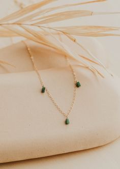 We’re in our Color Era and we’re vibing hard with these colorful stones right now. Gemma Trio is inspired by our Quinate Necklace, just a more colorful version! Three 2x4mm stones drop from our delicate cable chain. Necklace measures 17" + 1" extender. Available in Moss (African Green Jade) + Seafoam (Green Aventurine) + Ash (Black Labradorite). Available in 14kt Gold Fill + Sterling Silver. Shop the entire Gemma Collection. Handmade in Eau Claire, WI. Our jewelry is handmade so each piece will Trio Necklace, Everyday Wear Jewelry, Colorful Stones, Black Labradorite, Jewelry Photoshoot, Cable Chain Necklace, Silver Shop, Green Jade, Seafoam Green