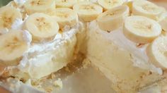 a banana cream pie is cut in half on a plate