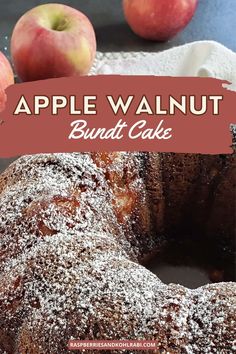 an apple walnut bundt cake with powdered sugar on top and apples in the background