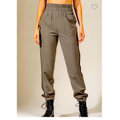 Best Seller And Right On Trend. Smock Elasticized High Waisted Jogger Activewear Pants. Featuring Side Pockets. Color Army Green. The Staple That Every Wardrobe Needs. Made Of A Soft Flowy Polyester. Sizes S, M, L. Size Small Waist 26” Laying Flat Rise 14” Inseam 28” Hips 40” Size Medium Waist Laying Flat 30” Rise 15” Inseam 29” Hips 42” Size Large Waist Laying Flat 30” Rise 15” Inseam 29” Hips 44” Other Colors Have Their Own Listings. Search: Braided Cavay Vacation Cruise Flirty Date Night Crui Trendy Khaki Pants With Elastic Waistband, Chic Stretch Cargo Pants With Elastic Waistband, Trendy Pants With Elastic Waistband, Trendy High Waist Parachute Pants With Elastic Waistband, Trendy High Waist Stretch Joggers, Trendy Khaki Bottoms With Elastic Waistband, High Waist Stretch Cargo Pants With Elastic Waistband, Stretch Cargo Pants With Elastic Waistband For Fall, Fall Stretch Cargo Pants With Elastic Waistband