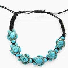 This Braided Bracelet Not Only Adds A Touch Of Hawaiian Charm And Beach Life To Your Ensemble But Also Carries The Profound Symbolism Of The Sea Turtle. Symbolizing Wisdom, Longevity, And Protection, The Sea Turtle's Meaning Resonates Deeply. * Adjustable Black Cord With Turquoise Turtle Beads * Small Turquoise Beads On The Ends For Extra Charm * Perfect Accessory For Any Occasion Or Outfit * Great Gift Idea For Turtle Lovers Or Jewelry Collectors Hand Wrapped Black Beaded Bracelets For Beach, Turquoise Jewelry With Sliding Knot For Vacation, Hand Wrapped Black Beach Jewelry, Hand Wrapped Black Jewelry For Beach, Bohemian Turquoise Beaded Bracelets With Black Beads, Bohemian Turquoise Beaded Bracelet With Black Beads, Turquoise And Black Beaded Bohemian Bracelet, Blue Jewelry With Black Beads For Beach, Turquoise Adjustable Beach Bracelets