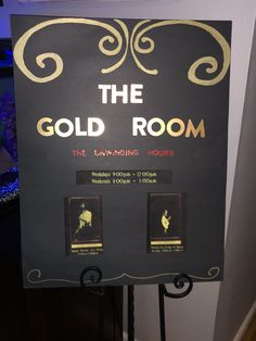 the gold room sign in front of a fish tank