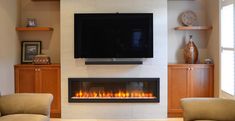 a flat screen tv mounted above a fireplace in a living room