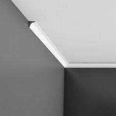 a black and white photo of a toilet in a bathroom with a skylight above it