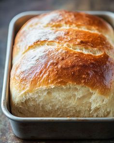 a loaf of bread in a metal pan