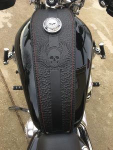 a close up of a motorcycle seat with a skull on it