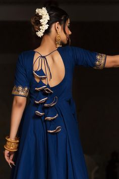 One of our timeless classics, hand-stitched exclusively for your bespoke taste. Channel your desi diva vibes and experience luxury in our all-time favorite festive collection comprising a blue Cotton anarkali with Cotton Pants and soft net Dupatta. Crafted in premium quality Cotton fabric, the blue cotton anarkali comes lace work over neck, sleeves and bottom of anarkali as well as dupatta. PRODUCT DESCRIPTION: Kurta & Pant: Cotton Dupatta: Soft Net Color: Blue No. Of Components : Set of 3 Embro Kurta Designs Back Neck, Anarkali Kurta Back Neck Design, Anarkali Suits Neck Designs, Dori Suit Design, Anarkali Suits Back Neck Design, Suit Dori Design, Anarkali Suit Back Neck Design, Neck Design For Anarkali Suit, Blue Anarkali Dress With Dupatta