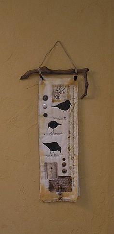 a wall hanging with birds on it