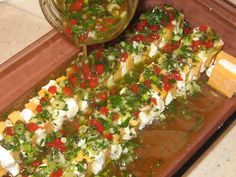 the food is being prepared and ready to be eaten on the tray for servings