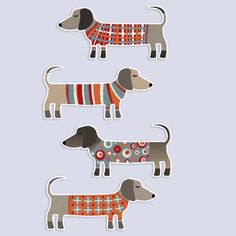 three stickers with dogs wearing sweaters on them