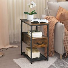 a living room scene with focus on the end table and book shelf that holds books