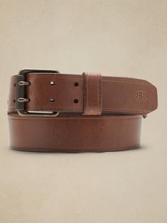 Luxury at first sight, this sturdy leather belts puts a spin on a timeless original with a double-pronged buckle.  LEATHER WORKING GROUP: By purchasing this product, you are supporting responsible leather manufacturing through the Leather Working Gro Leather Belt Buckle With Removable Belt For Everyday Use, Leather Belt Buckles With Removable Belt For Everyday Use, Rugged Leather Belt Buckles For Everyday Use, Rugged Belt Buckles With Leather Strap For Everyday Use, Rugged Leather Belt With Removable Feature, Rugged Leather Belt Buckles With Leather Strap, Rugged Leather Belt Buckles With Strap, Rugged Leather Belt Buckles, Rugged Leather Belt