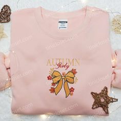 Autumn Girly Coquette Bow Embroidered Shirt As the leaves begin to paint the world in hues of crimson and gold, there’s no better time to envelop yourself in the cozy charm of autumn. Tinicloset invites you to experience the season’s magic through our exquisite collection of embroidered sweatshirts, T-shirts, and hoodies. Our Autumn Girly Coquette... Holiday Embroidered Tops For Fall, Cute Floral Embroidery Fall Tops, Cute Custom Embroidered Tops For Fall, Cute Tops With Custom Embroidery For Fall, Pink Custom Embroidered Tops For Fall, Pink Tops With Custom Embroidery For Fall, Pink Top As Gift For Fall, Pink Top As Fall Gift, Halloween Embroidery Shirts