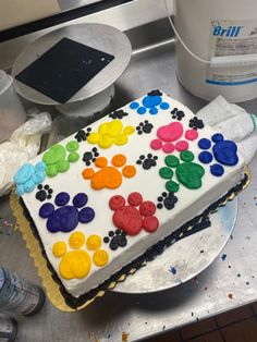 there is a cake that has been decorated with paw prints