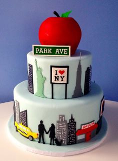 a three tiered cake with an apple on top and the words park ave painted on it