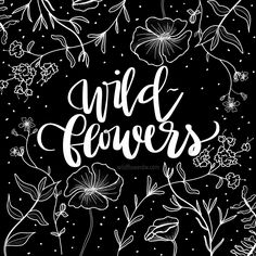 the words wild flowers written in white ink on a black background