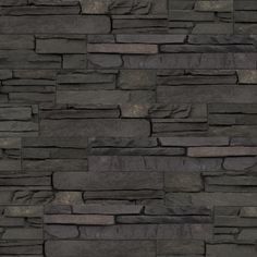 an image of a stone wall that looks like it is made out of black slate