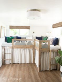 a room with wooden floors and white walls