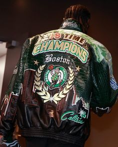 the back of a man wearing a leather jacket with an image of a starbucks logo on it